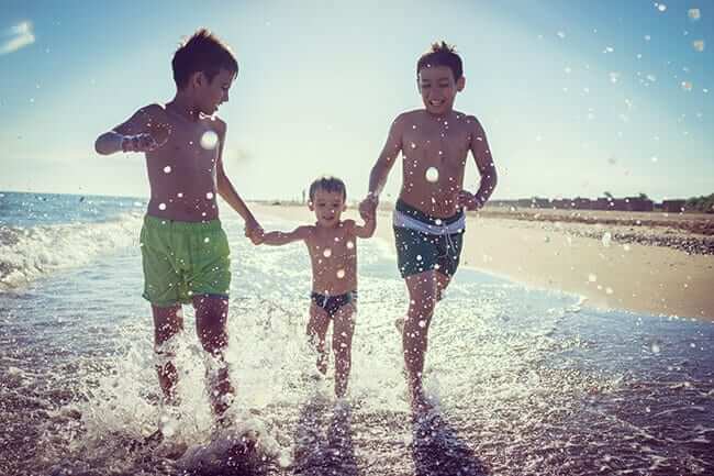 children running on beach