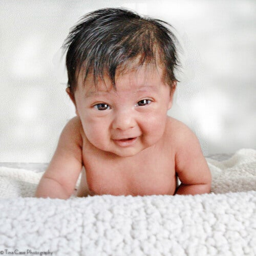 By four to five months of age a baby is able to hold their head up for brief periods. [Tina Case Photo]