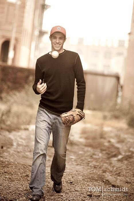 The smile and mood perfectly captures a young man's joy for baseball in his senior portrait -- bestkcseniorpictures.com/Pinterest
