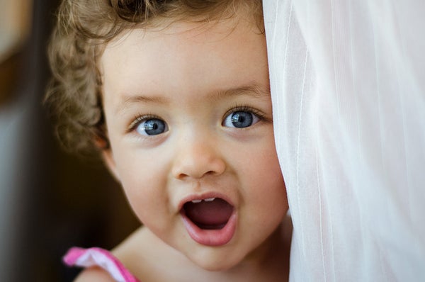 A toddler with her mouth open.