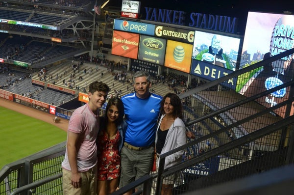 A family at a baseball game.