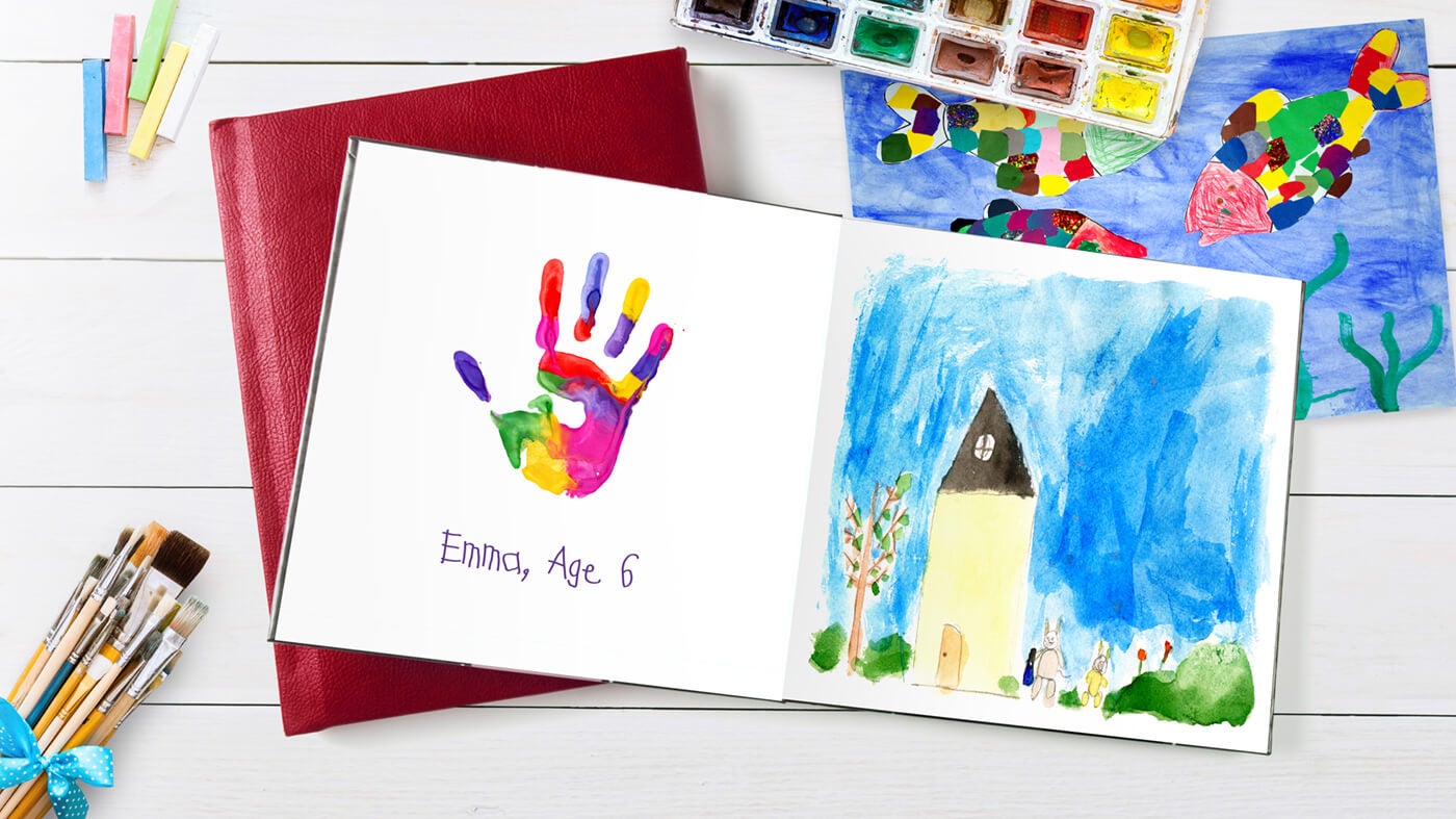 printique by adorama photo book with child's art in it
