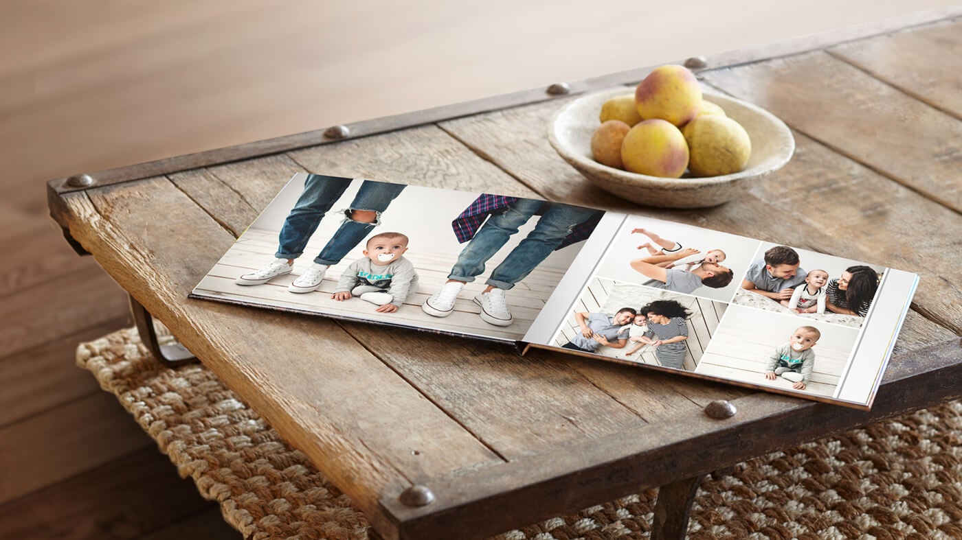 printique by adorama photo book on table showing family