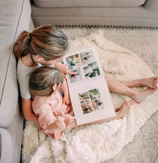 two children looking at themselves in an Printique photo book