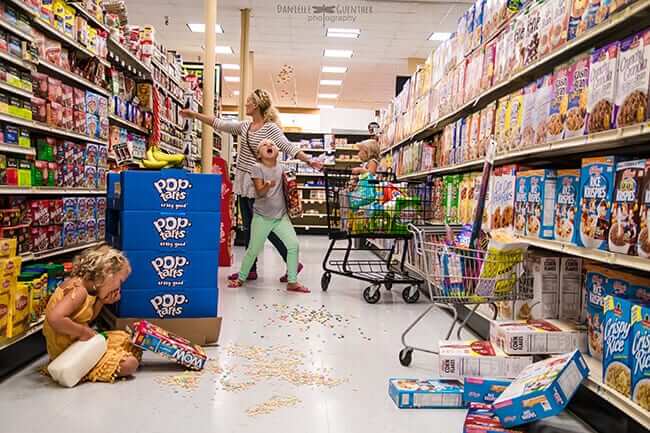 mom and children in grocery aisle