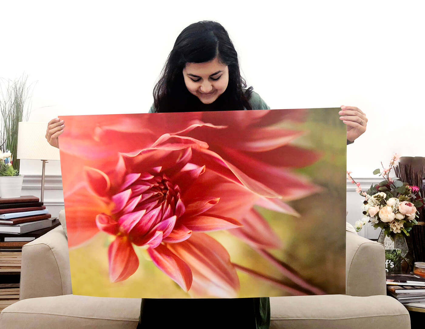 girl holding up fine art print of flower by printique