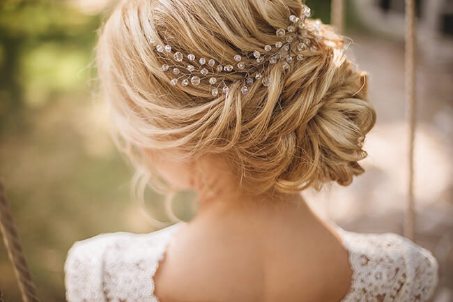 bride updo with accessory