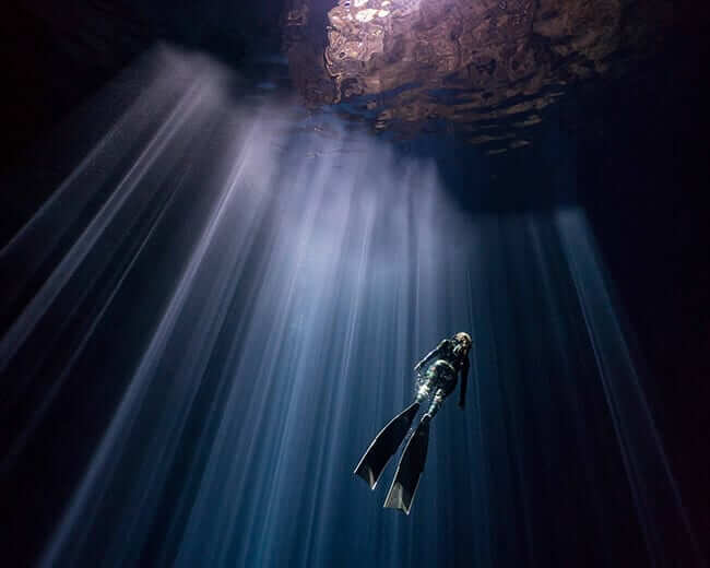 woman diving underwater