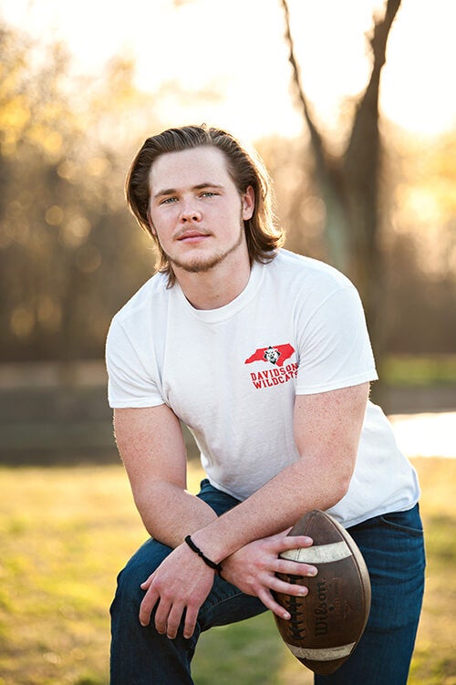 high school senior boy posing