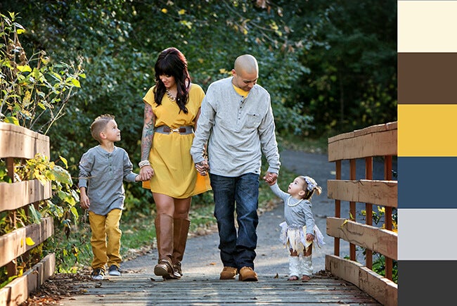 family walking on bridge for fall portrait