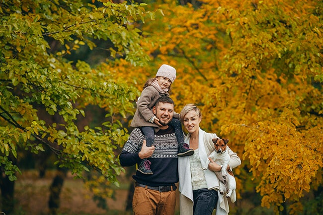 family fall portrait with child and dog