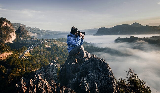 photographer on top of mountain