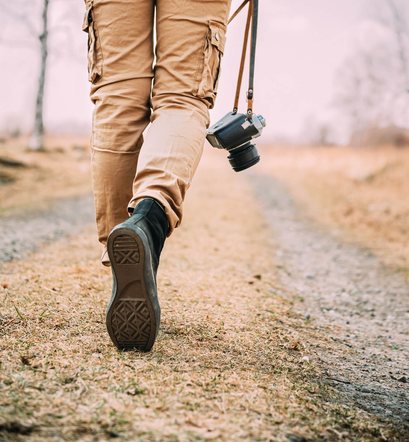 man walking with camera