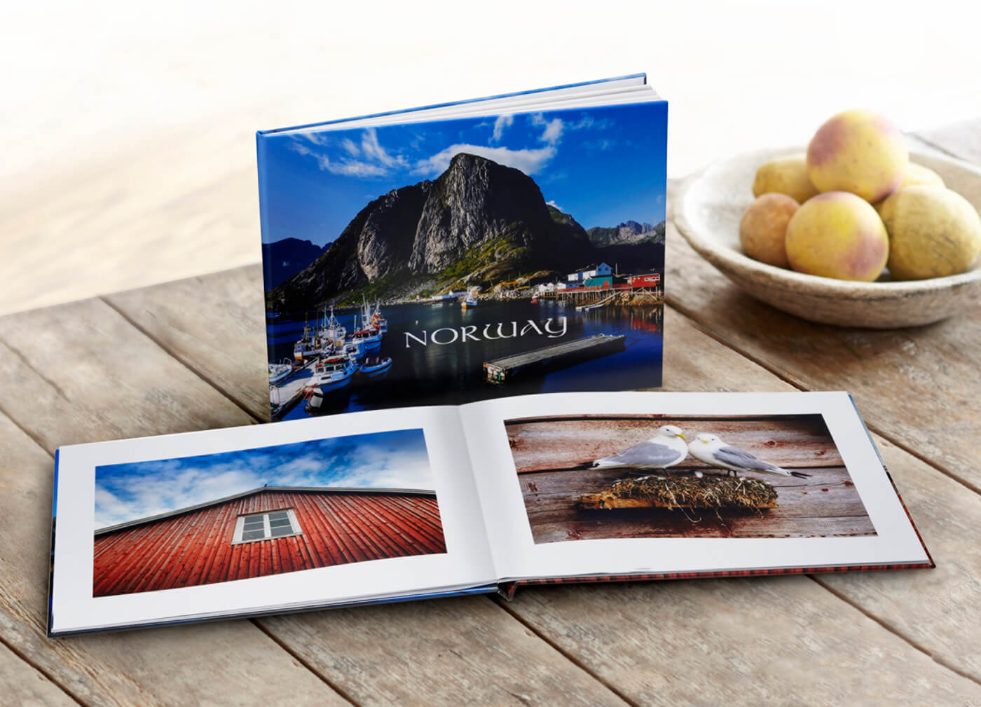 photo book of norway by printique on table