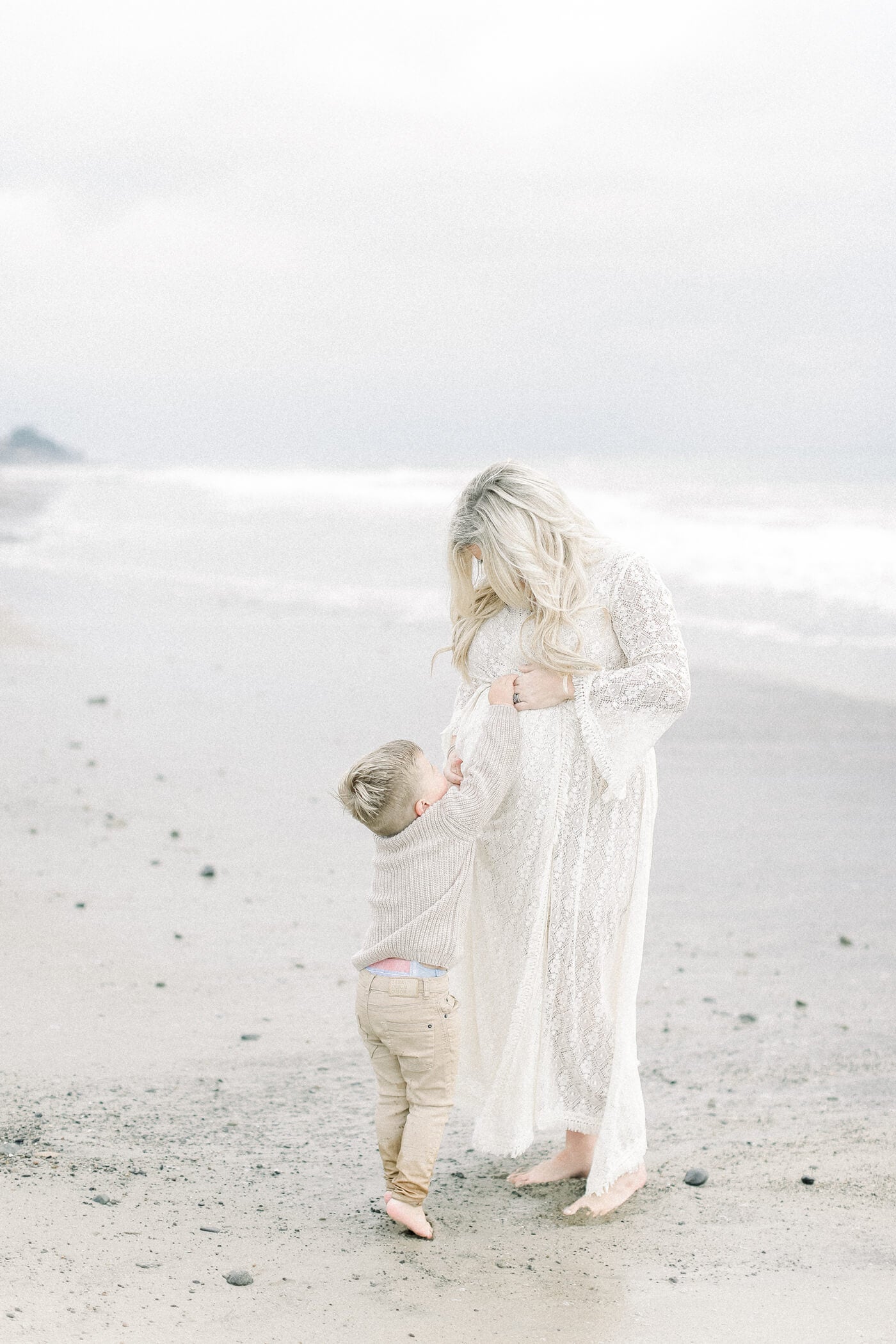 mom and son interacting for beach portrait