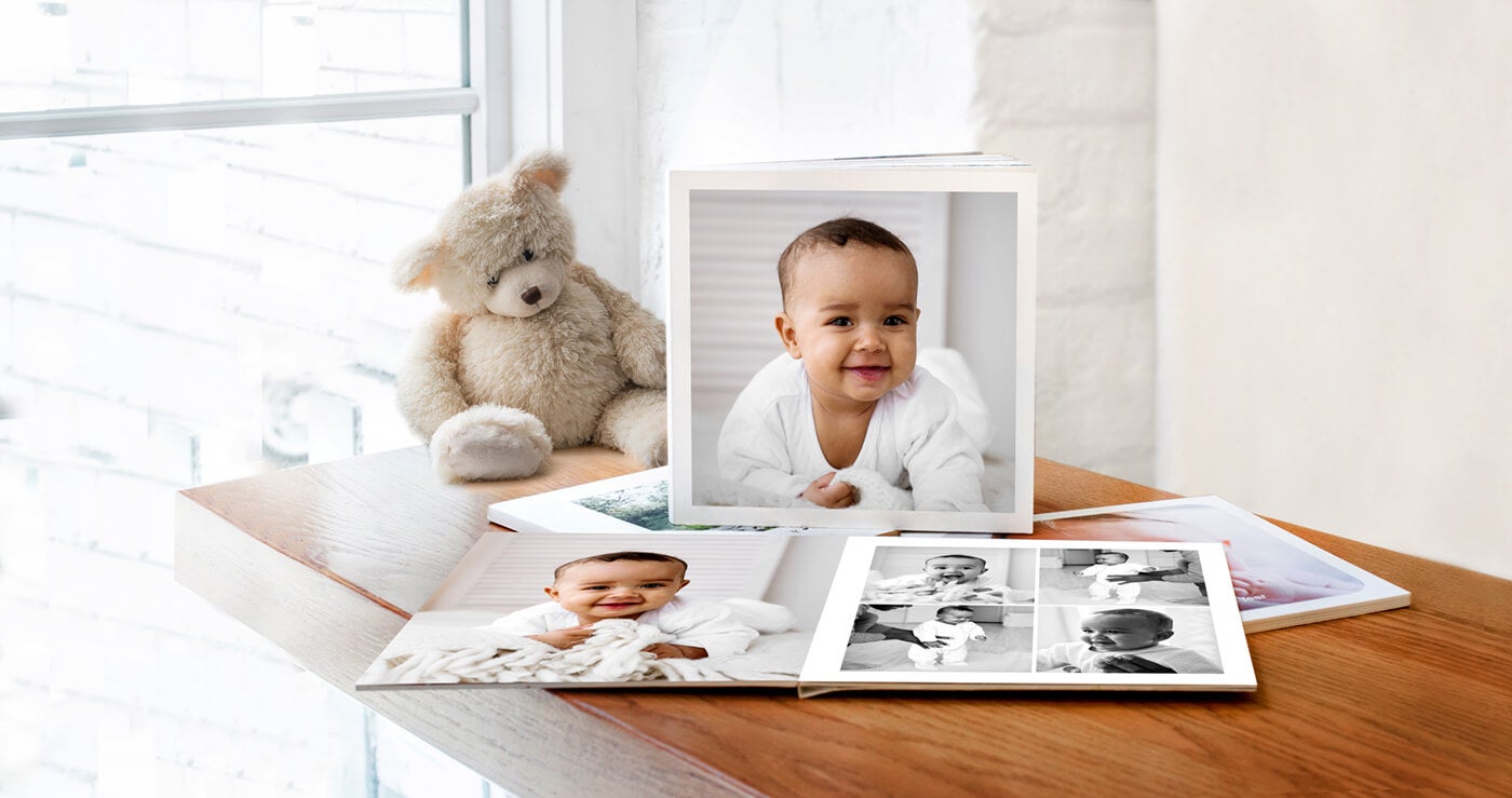 baby softcover photo book on table