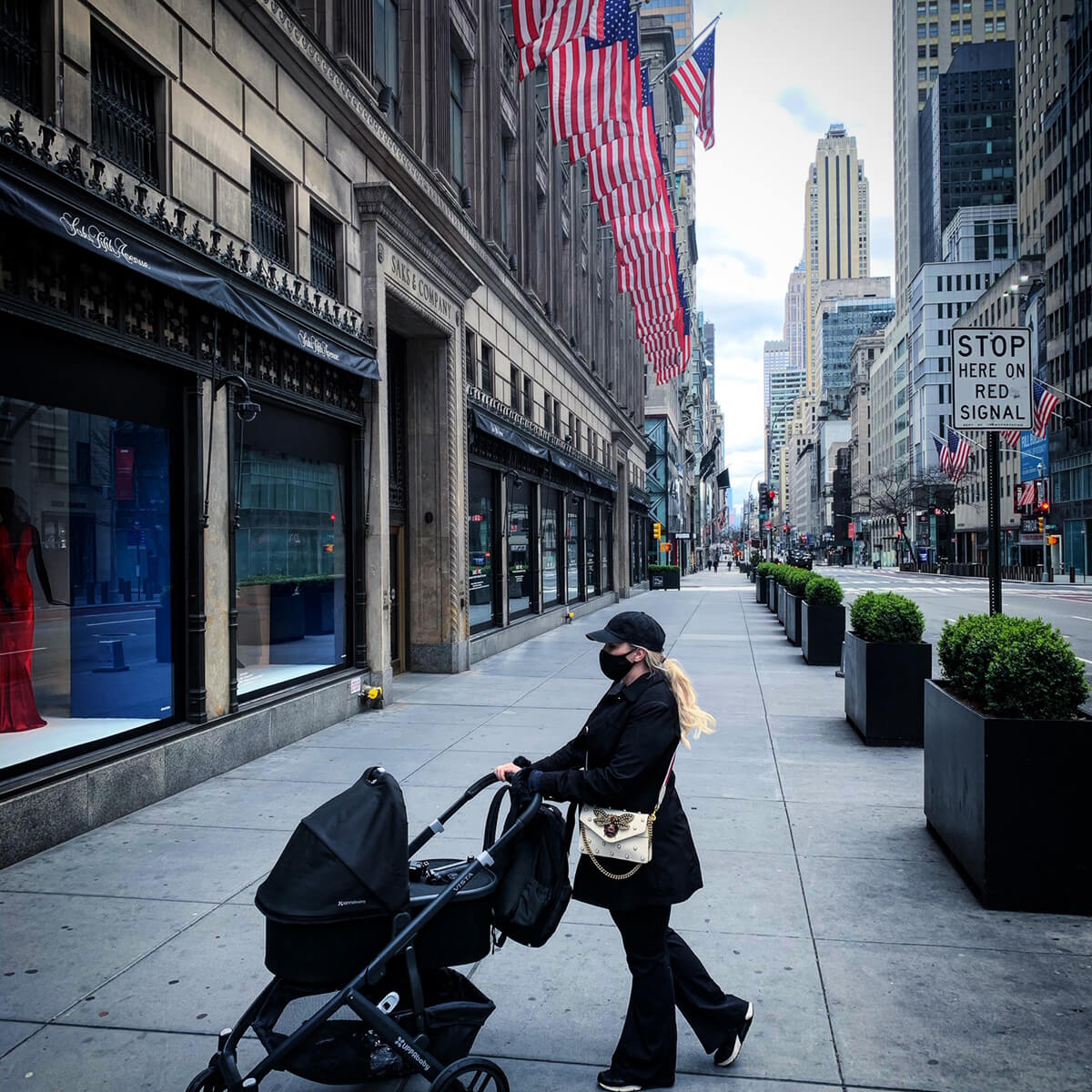 mother pushing carriage in streets of nyc