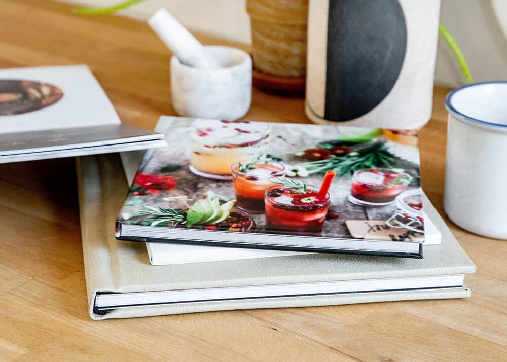 photo books on table by printique