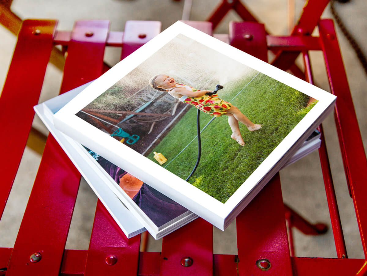 photo book by printique on chari showing girl with water hose