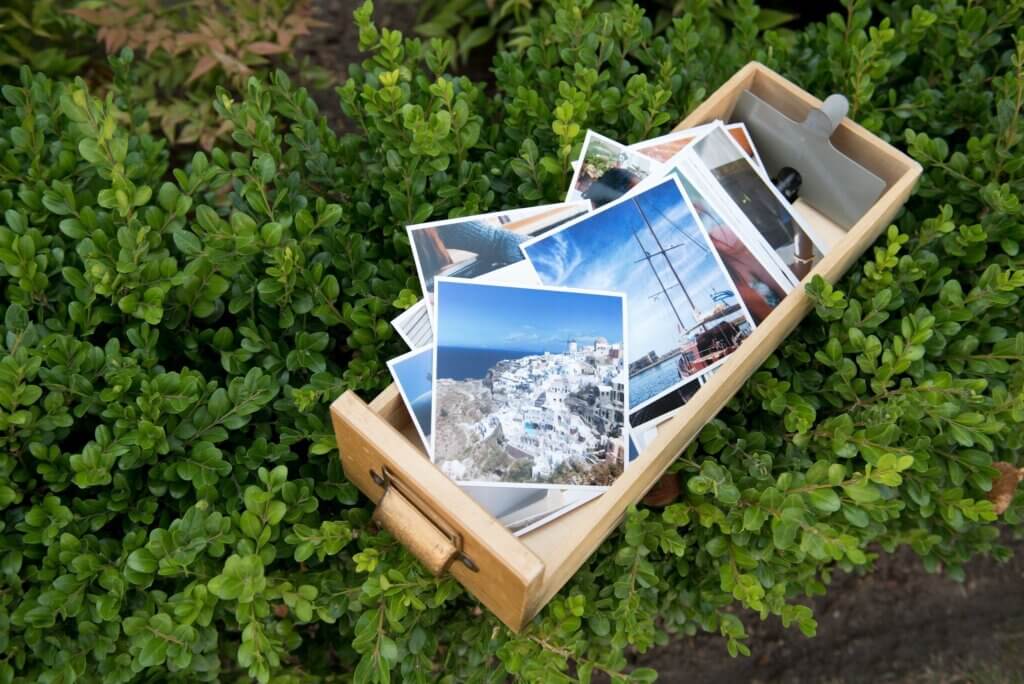 Box of classic photo prints for college dorm decorating.