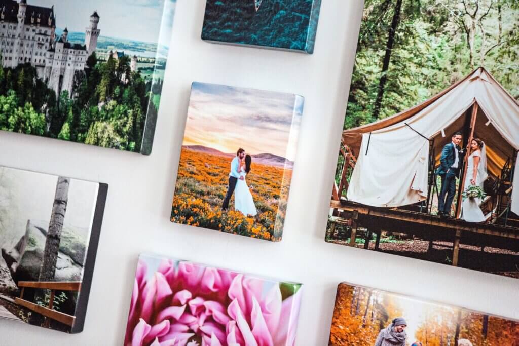 Hanging canvas prints of couples.