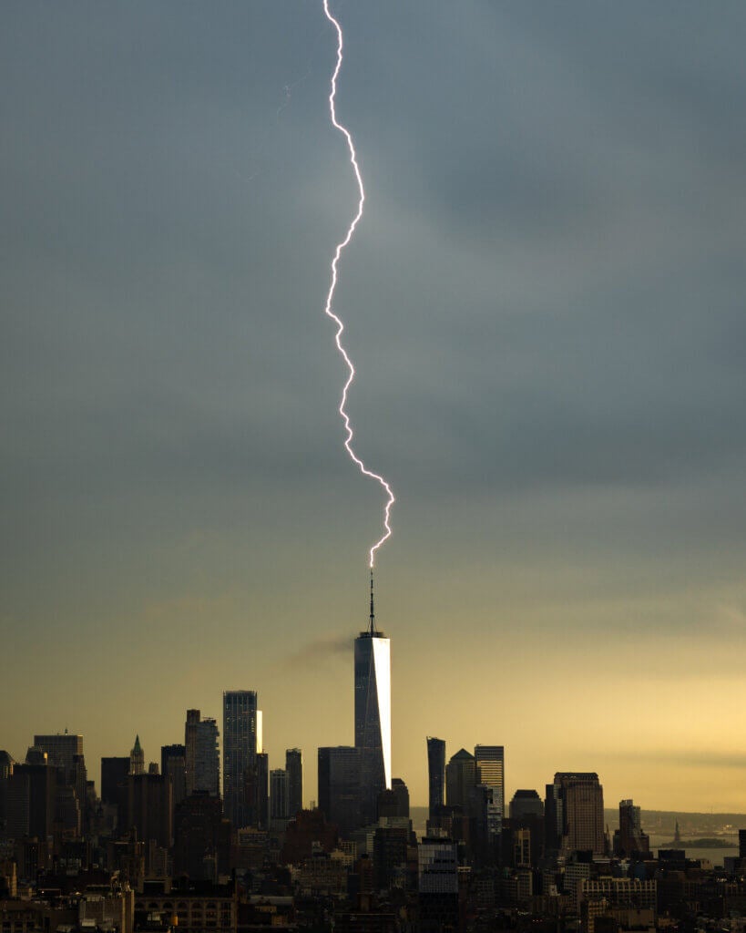 Beautiful photograph shows lightning striking the freedom tower during a summer storm.