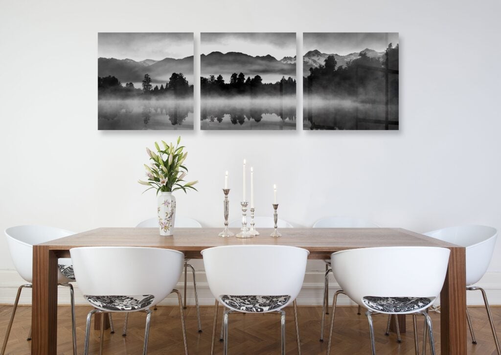 Paneled metal prints create an elegant gallery feel in the living room of a new home.