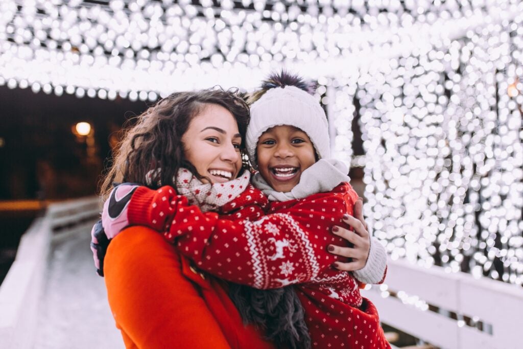 Mother and son smile for their Christmas card picture.