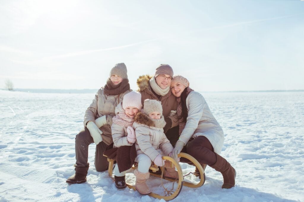 Family takes advantage of natural outdoor light to get a great picture for their holiday card.