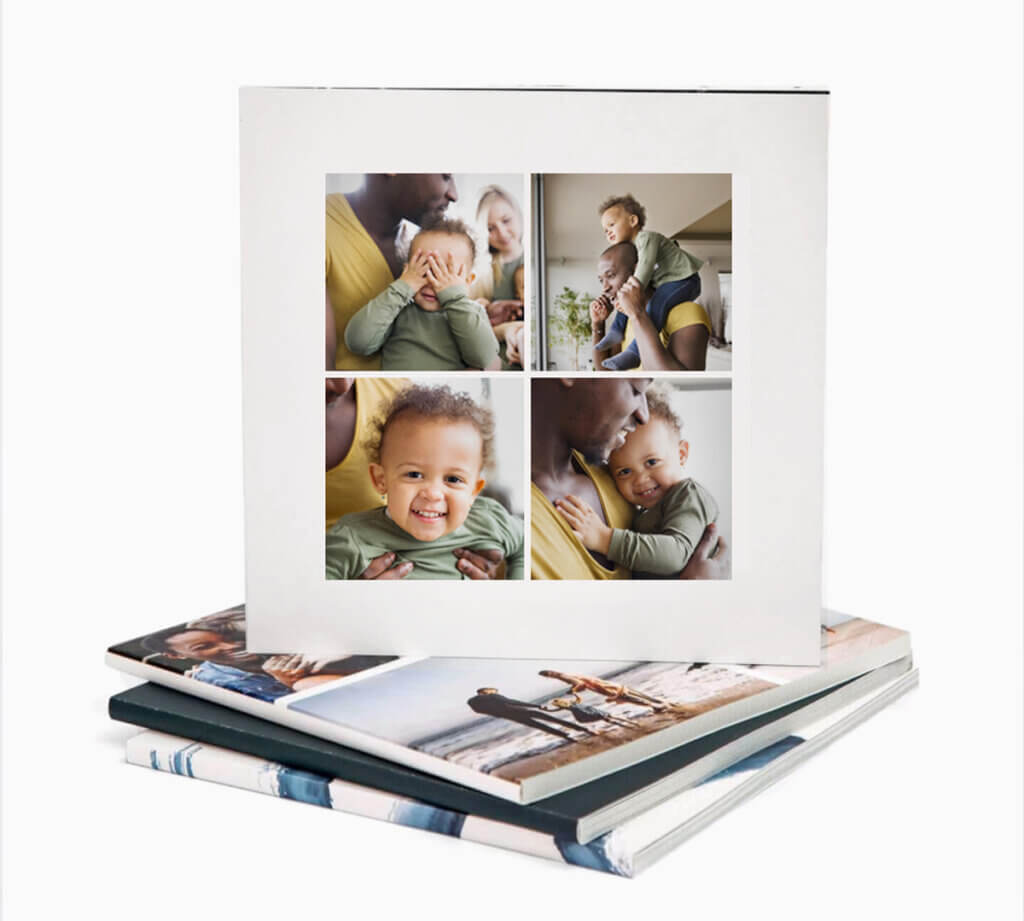 A father and child laugh on the cover of a mini photo book.