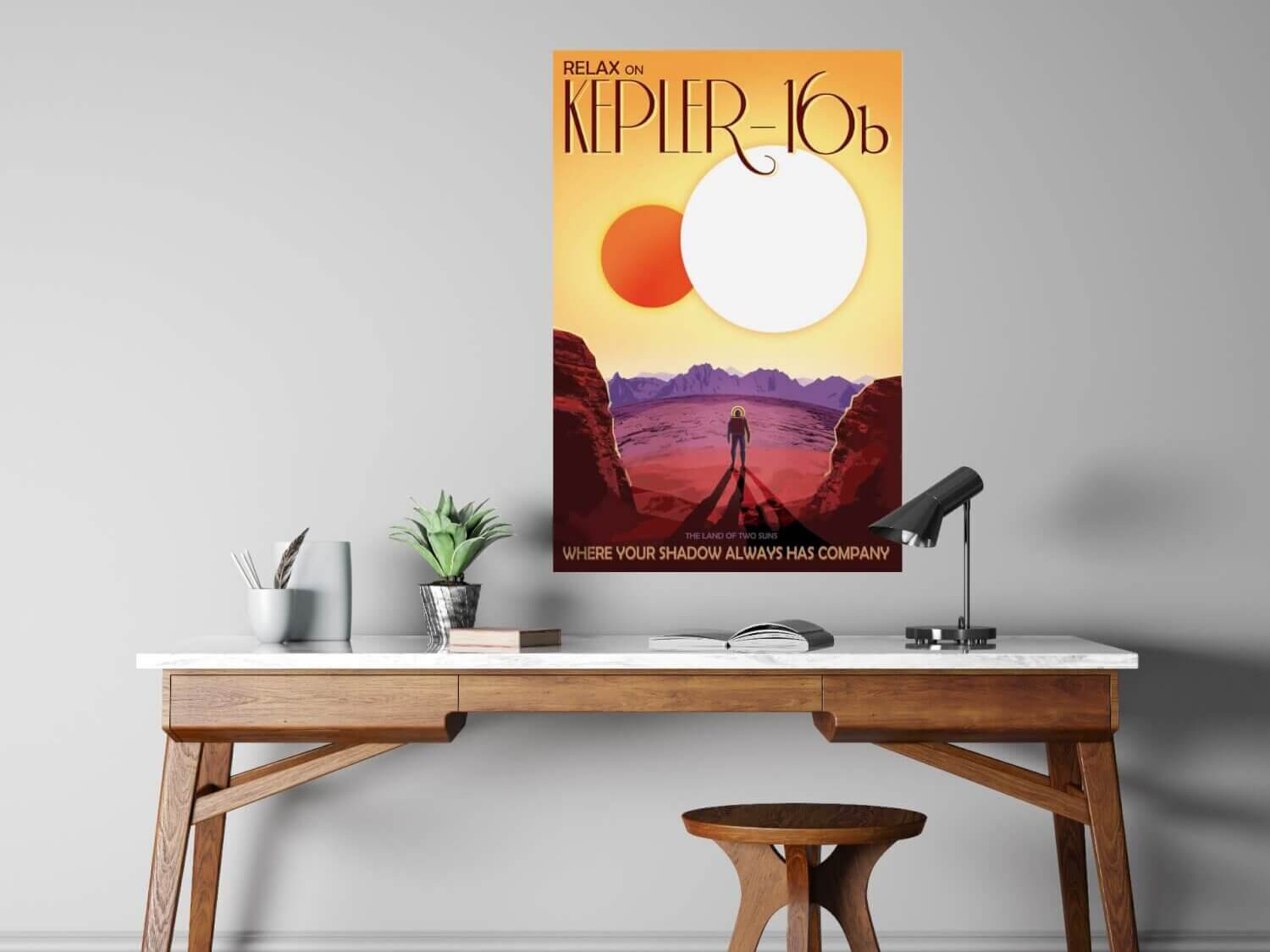A free print design created by NASA's design team depicts a space traveler standing before the two suns of planet Kepler-16b.