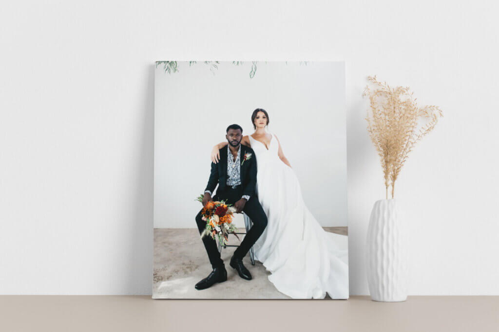 Newly-wed couple poses in romantic wedding canvas print.