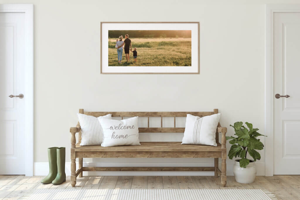 A scenic family photo framed in light washed wood adds warm and personalized elements to a farmhouse home aesthetic.