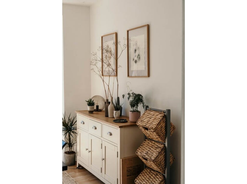 A boho interior style featuring simple framed print displays.