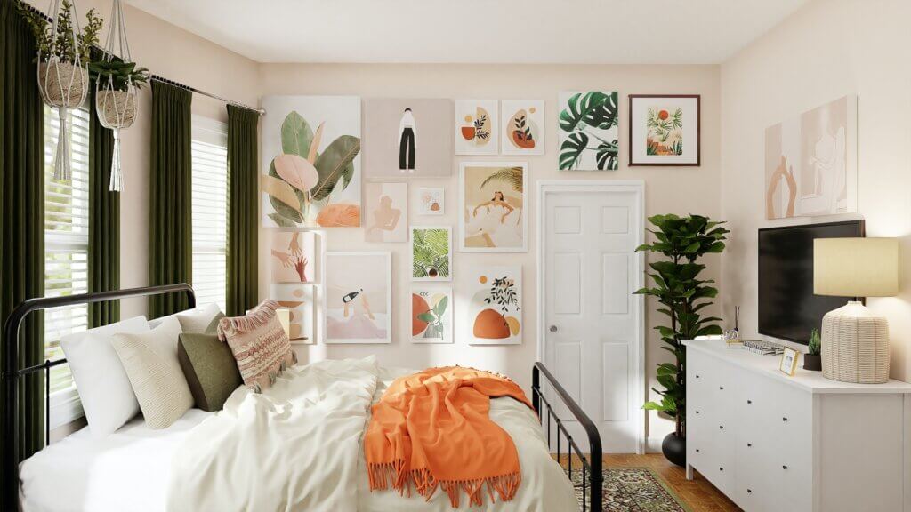 Colorful prints of orange and green arranged in a wall gallery to establish a tropical home aesthetic.