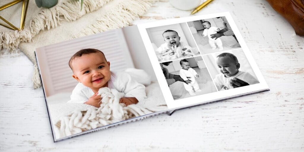 Adorable baby smiles in a picture displayed in a baby photo book.