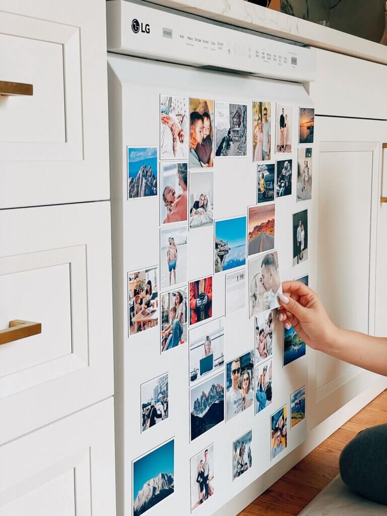 Photo prints are used to decorate a magnetic dishwasher in this frame-free way to use photo prints.