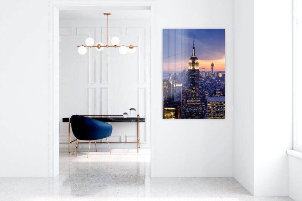 An Empire State Building photo on metal decorates a chic and elegant New York City apartment.