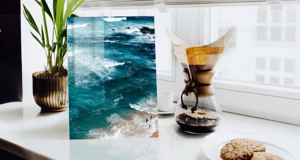 A vibrant beach photograph displayed in a kitchen on a durable metal photo print.
