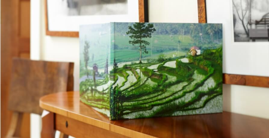 A travel album stands to display its beautiful full image wrapping.