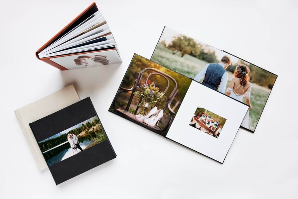 Spread of beautiful custom photo albums depicting wedding photographs.